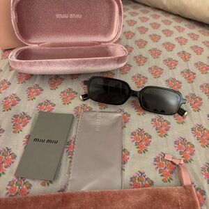 Miu Miu Black and Gold Sunglasses new
